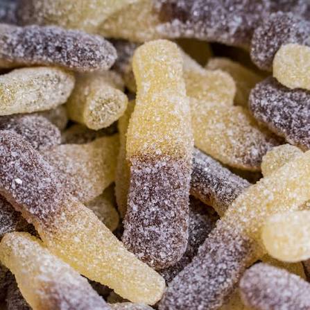 THC infused sour cola bottle gummies dusted in sour sugar